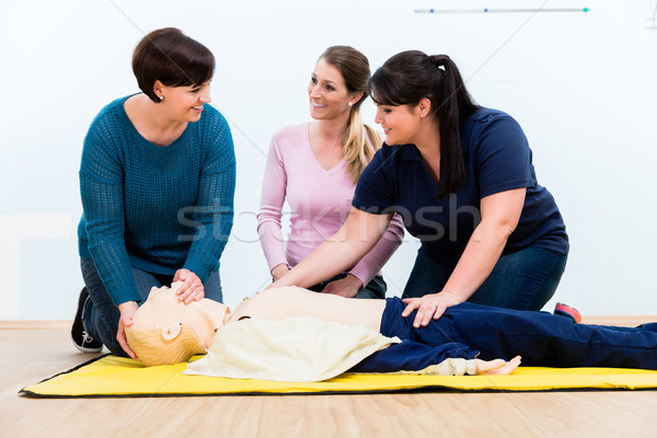 Stock photo: Group of women in first aid course