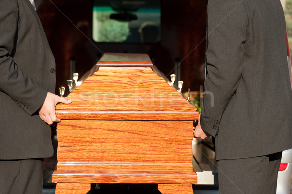 Funeral with casket carried by coffin bearer Stock photo © Kzenon