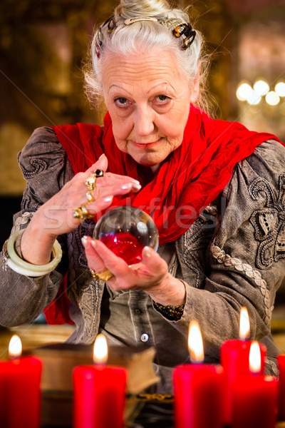 Soothsayer during session with crystal ball Stock photo © Kzenon