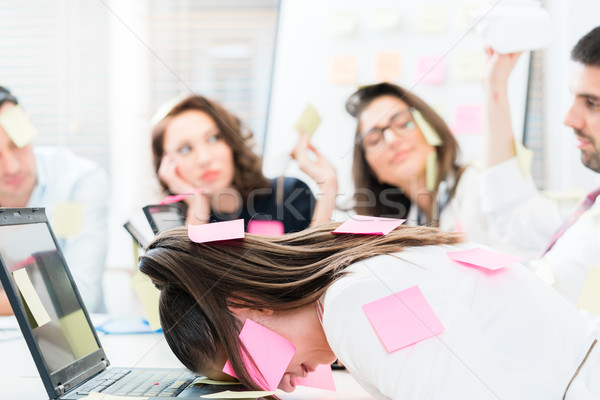 Women and men in office being tired and frustrated Stock photo © Kzenon