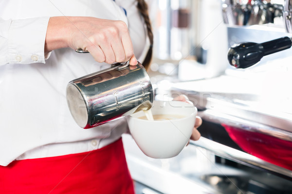 Közelkép kezek pincérnő áramló tej kávé Stock fotó © Kzenon