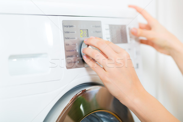 Stock photo: Housekeeper with washing machine