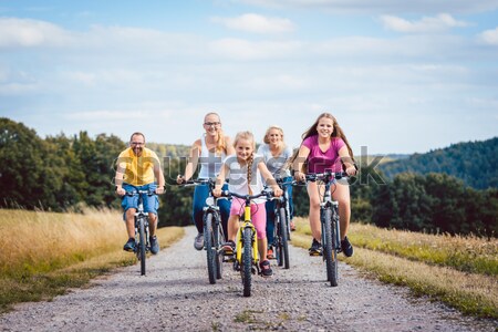 Familie Radfahren Sommer drei Mädchen Stock foto © Kzenon
