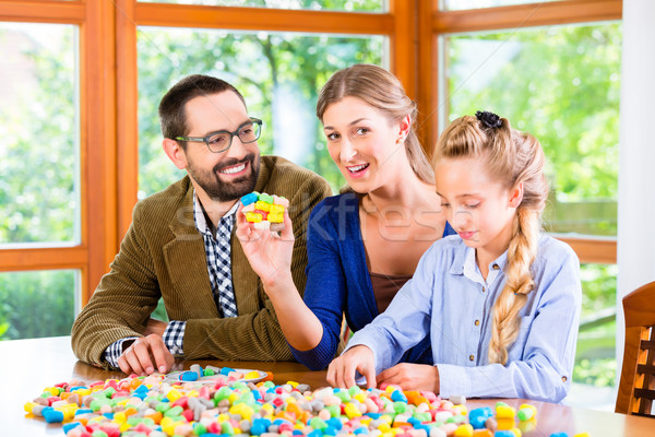 Family spending quality time playing together Stock photo © Kzenon