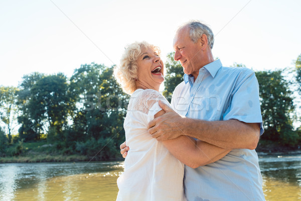 Romantic senior couple enjoying a healthy and active lifestyle Stock photo © Kzenon