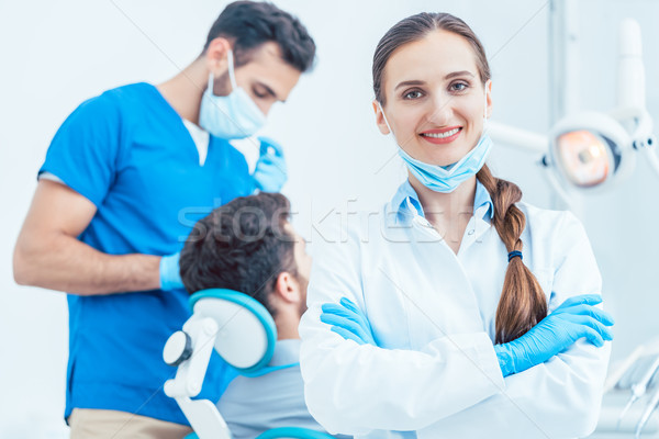 Retrato feminino dentista olhando câmera dental Foto stock © Kzenon