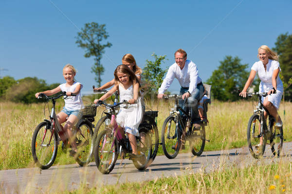 Family cycling outdoors in summer Stock photo © Kzenon