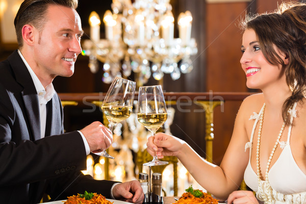 Heureux couple romantique date restaurant [[stock_photo]] © Kzenon