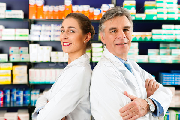 Team of pharmacists in pharmacy  Stock photo © Kzenon