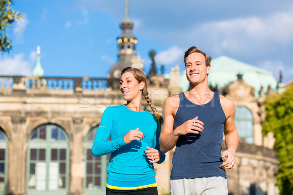 Couple running at Zwinger in Dresden Stock photo © Kzenon