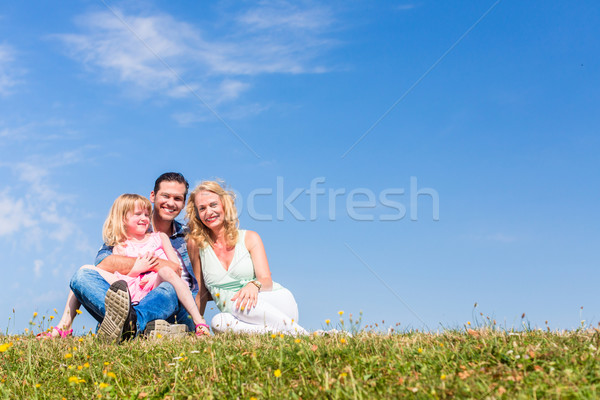 Mother, father, child, sitting in open air Stock photo © Kzenon