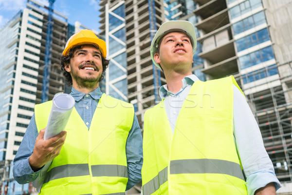 Architects supervising progress of high rise project Stock photo © Kzenon