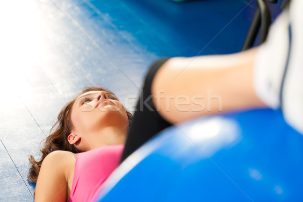 Fitness - Training and workout in gym Stock photo © Kzenon