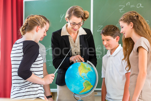 Teacher educate students  having geography lessons in school Stock photo © Kzenon