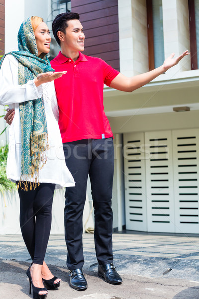 Asian Muslim couple choosing house Stock photo © Kzenon