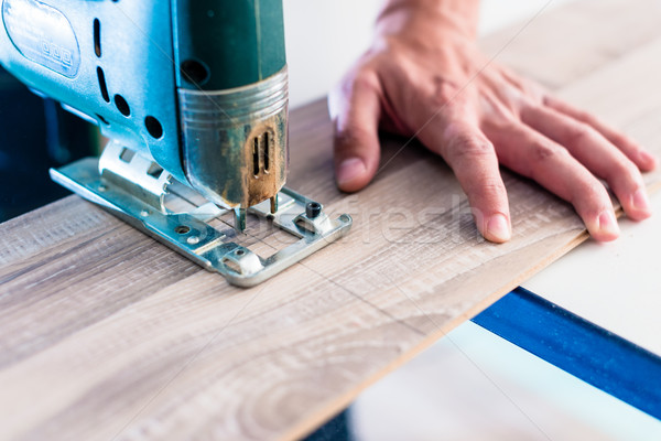 Csináld magad munkás vág fából készült panel fűrész Stock fotó © Kzenon