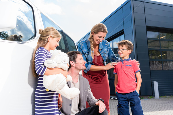Family with children buying auto at car dealer Stock photo © Kzenon
