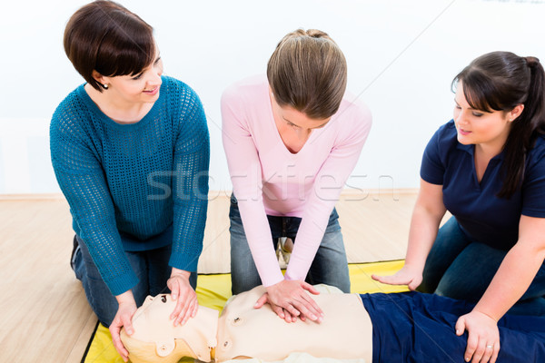 Group of women in first aid course Stock photo © Kzenon