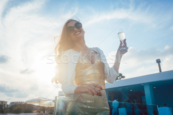 Woman having champagne at summer party Stock photo © Kzenon