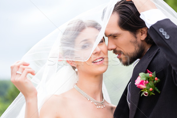 Casamento casal noiva noivo ocultação véu Foto stock © Kzenon