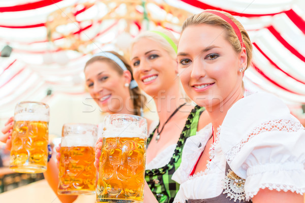 Friends drinking Bavarian beer at Oktoberfest  Stock photo © Kzenon