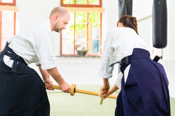 Homem mulher aikido espada lutar Foto stock © Kzenon