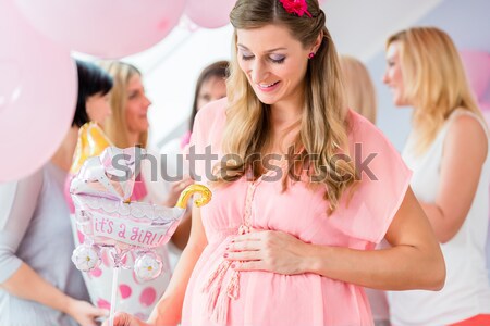 Girlfriends on shopping spree trying ladies hats and other fashi Stock photo © Kzenon