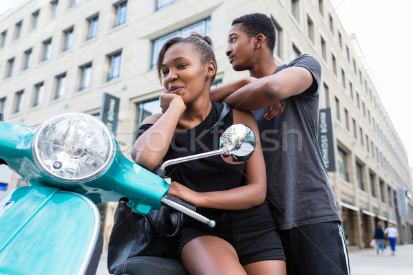 Stock fotó: Afroamerikai · fiatal · pér · dől · kék · moped · város