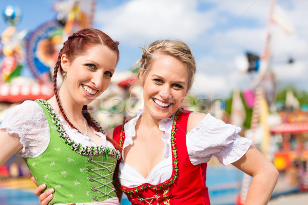 Women in traditional Bavarian clothes or dirndl on festival Stock photo © Kzenon