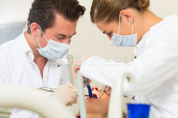 Paciente dentista dental tratamento feminino assistente Foto stock © Kzenon