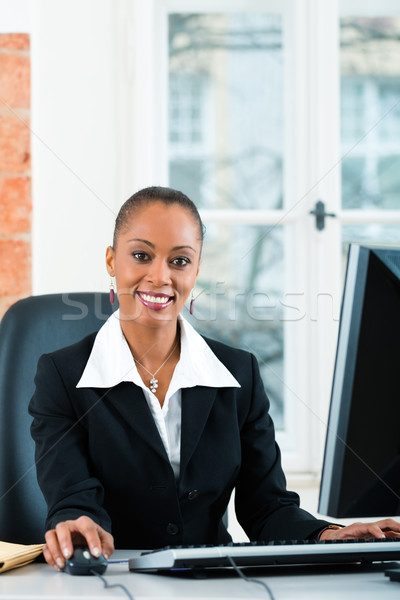 Lawyer in office sitting on the computer Stock photo © Kzenon