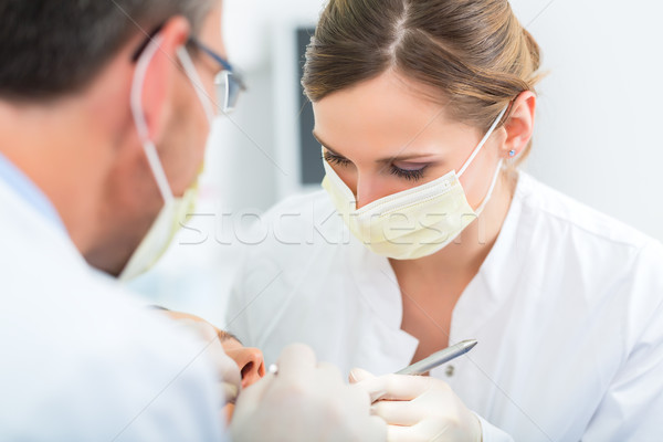 Patient with Dentist - dental treatment Stock photo © Kzenon