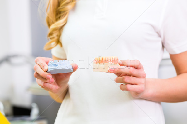 Dental technician checking denture  Stock photo © Kzenon