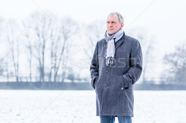 Depressed or sad man walking in winter Stock photo © Kzenon