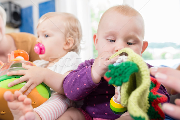 Bebês chupeta criança grupo jogar brinquedos Foto stock © Kzenon