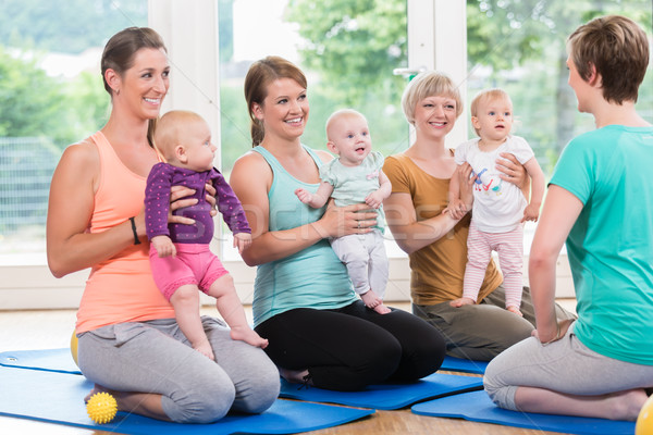 Women and their babies in mother-child gymnastic course Stock photo © Kzenon