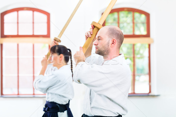 Homem mulher aikido espada lutar Foto stock © Kzenon