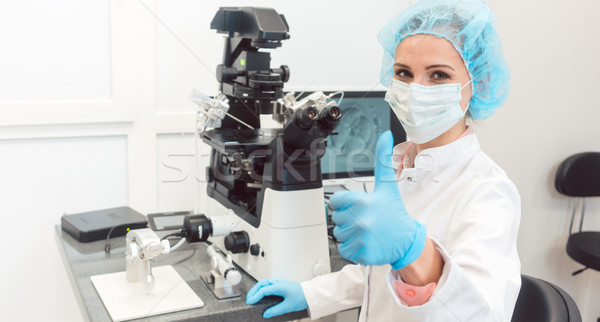 Doctor in fertility lab having just fertilized a human egg with  Stock photo © Kzenon