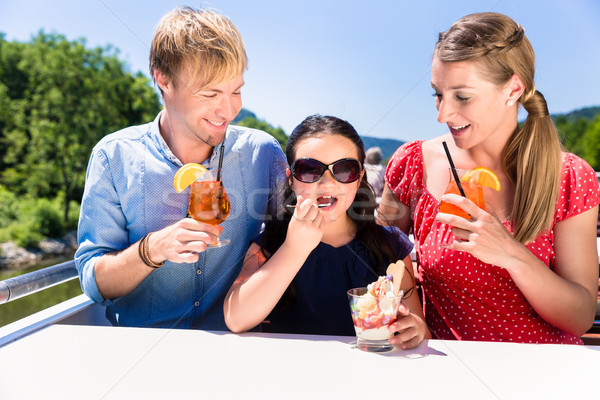 Family at lunch on river cruise with beer glasses on deck Stock photo © Kzenon