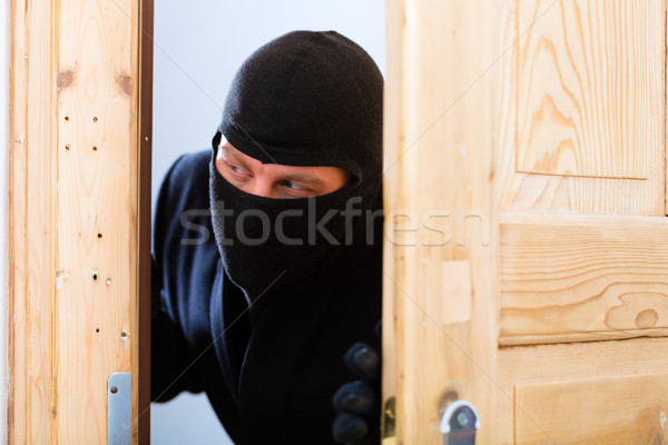 кража со взломом преступление грабитель открытие двери безопасности Сток-фото © Kzenon