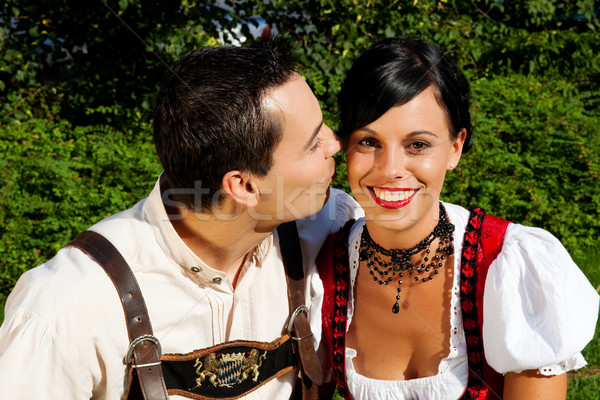 Couple in traditional Bavarian dress in summer Stock photo © Kzenon