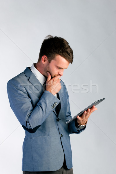 Stock photo: Businessman using tablet computer