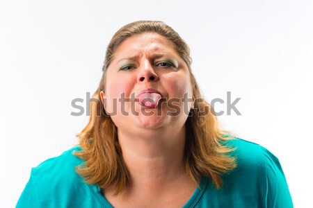 Fatty woman peeking through her finger Stock photo © Kzenon