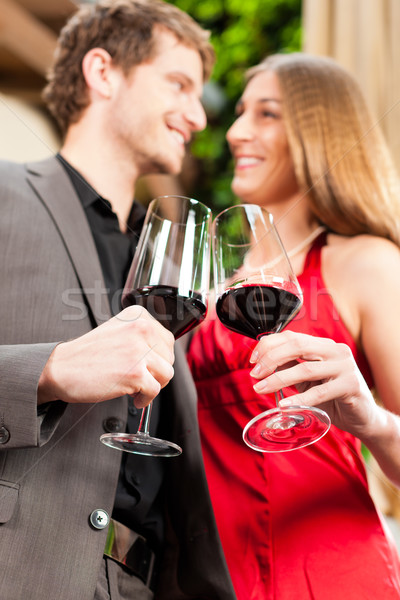 Stock photo: Man and woman tasting wine in restaurant