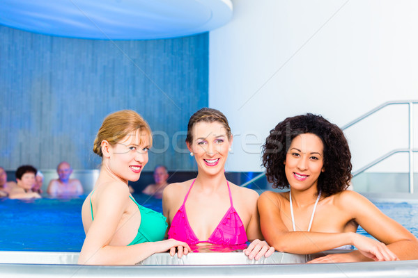 Women swimming in pool Stock photo © Kzenon