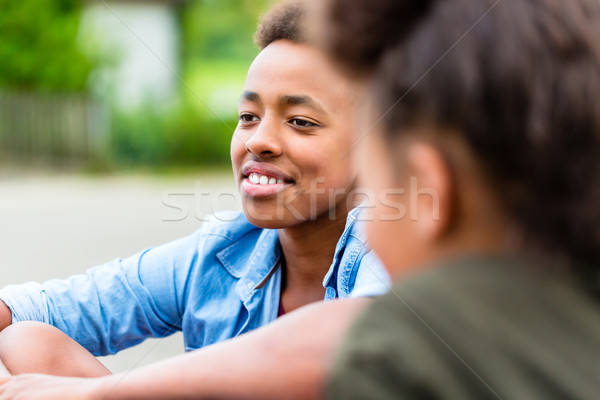 Siblings sitting on floor in yard Stock photo © Kzenon