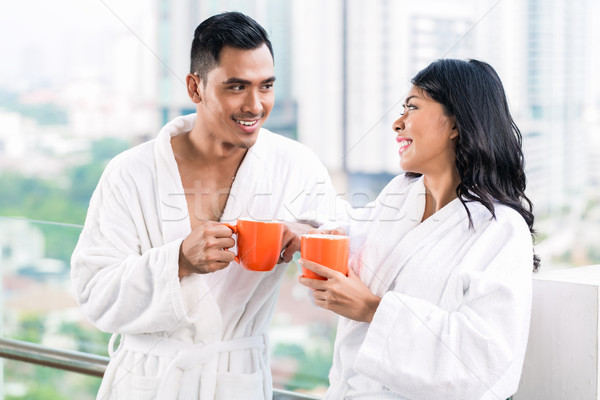 Asian couple in morning front of city skyline Stock photo © Kzenon