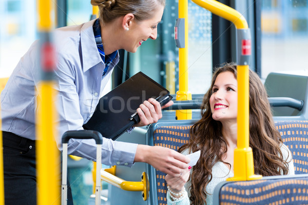 Woman in bus having no valid ticket at inspection Stock photo © Kzenon