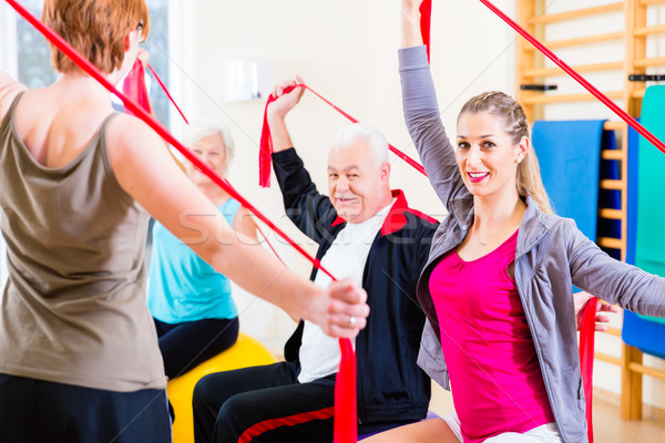 Senior people at fitness course in gym Stock photo © Kzenon