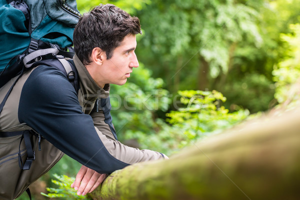 Stock photo: Young hiker taking breath in rest
